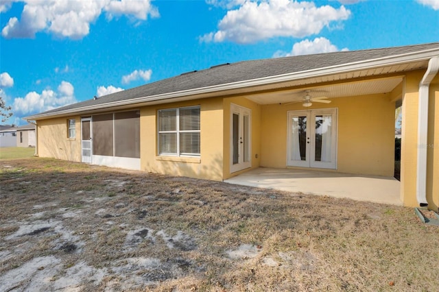 rear view of property with a patio, a lawn, ceiling fan, and french doors