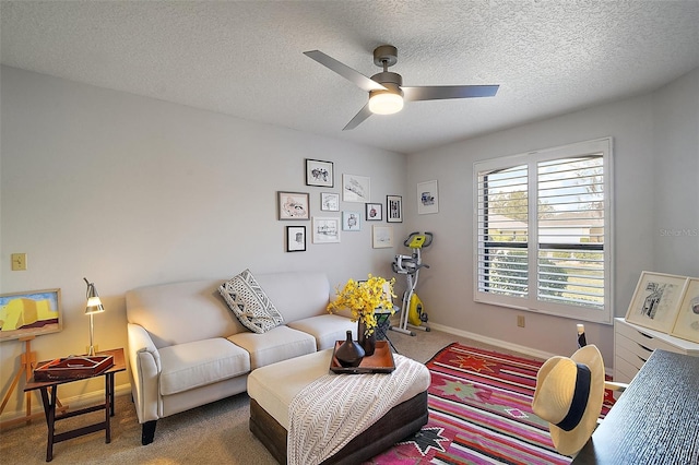 carpeted living room with a textured ceiling and ceiling fan