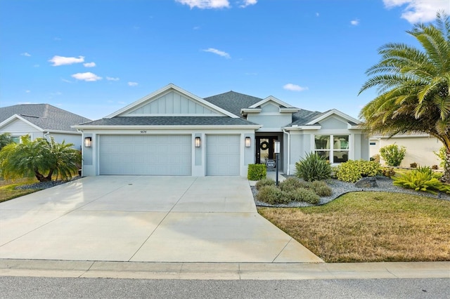 view of front of property with a garage and a front yard