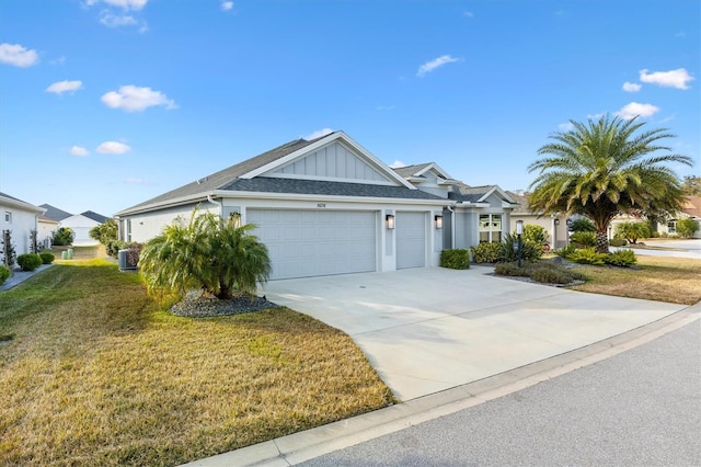 view of front of home with a garage and a front lawn