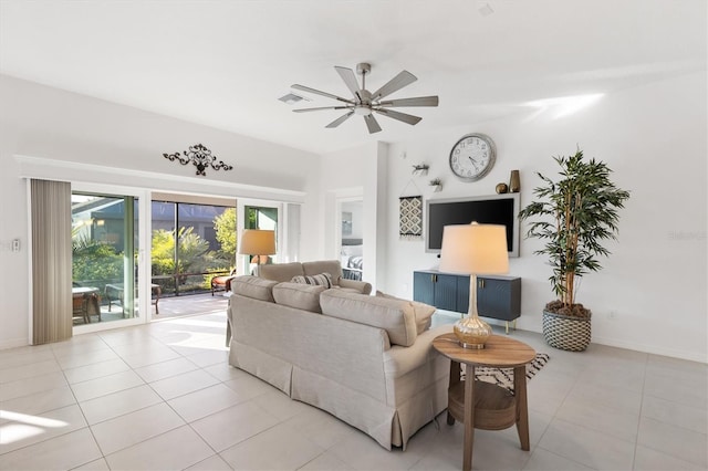 tiled living room featuring ceiling fan