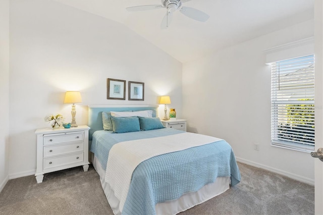 carpeted bedroom featuring multiple windows, lofted ceiling, and ceiling fan