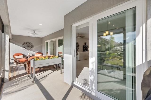 interior space with ceiling fan