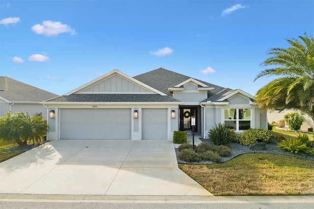 view of front of house featuring a garage and a front lawn