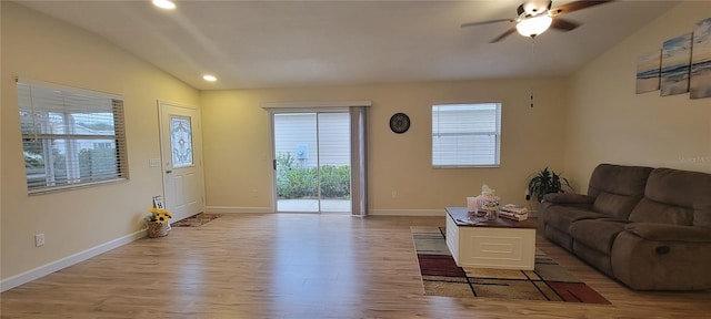 living area with light wood-style floors, recessed lighting, ceiling fan, and baseboards