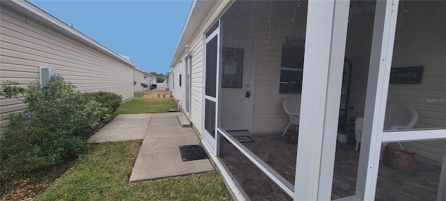 view of side of property featuring a patio