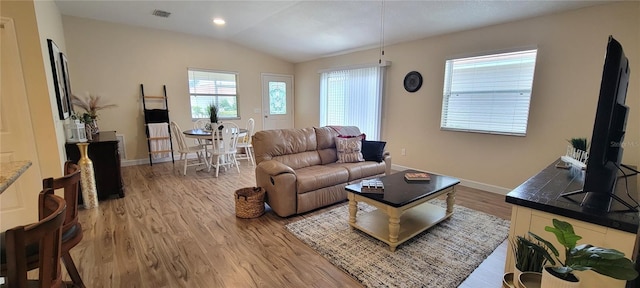 3621 Amelia Ave, The Villages, FL 32162 - living room with wood finished floors, vaulted ceiling, and recessed lighting