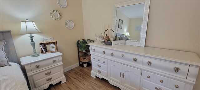 3621 Amelia Ave, The Villages, FL 32162 - bedroom / living area view of wood finished floors and baseboards
