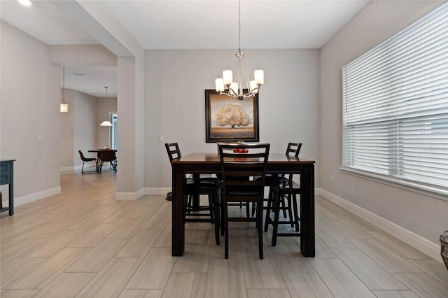 dining area featuring a chandelier