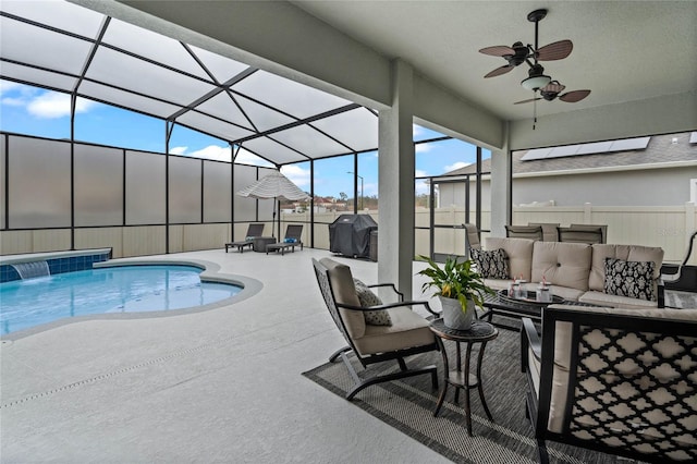 view of pool with pool water feature, grilling area, glass enclosure, an outdoor living space, and a patio area