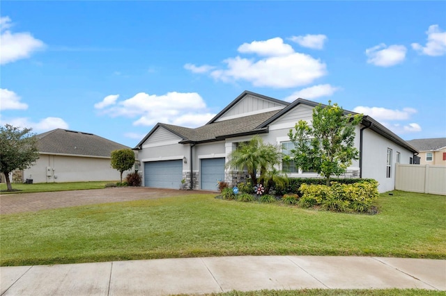 view of front of property with a garage and a front lawn