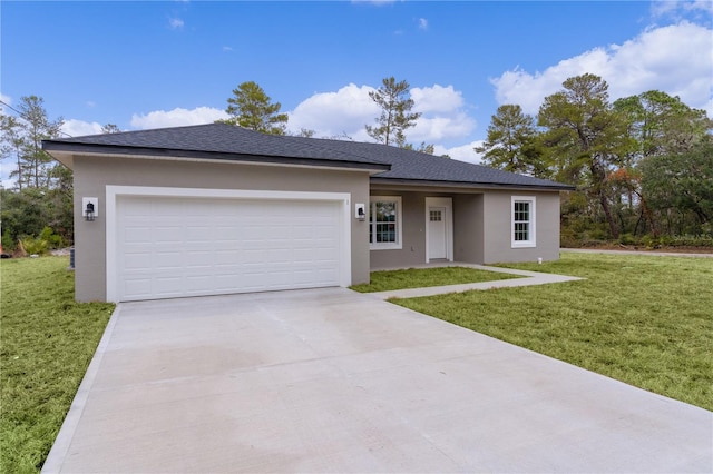 view of front of house featuring a garage and a front lawn