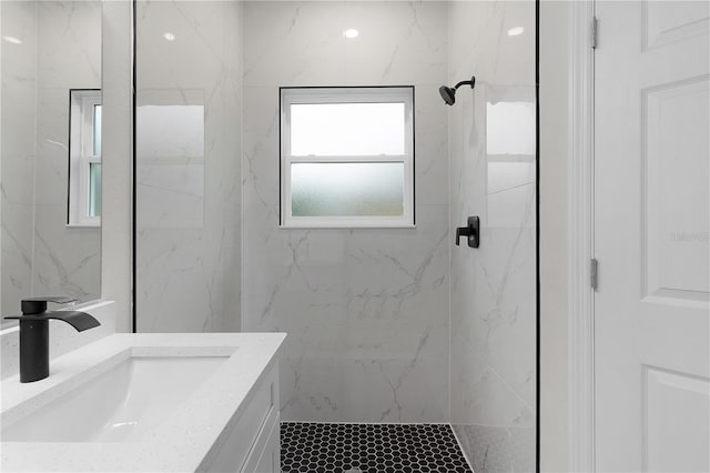 bathroom featuring vanity and a tile shower