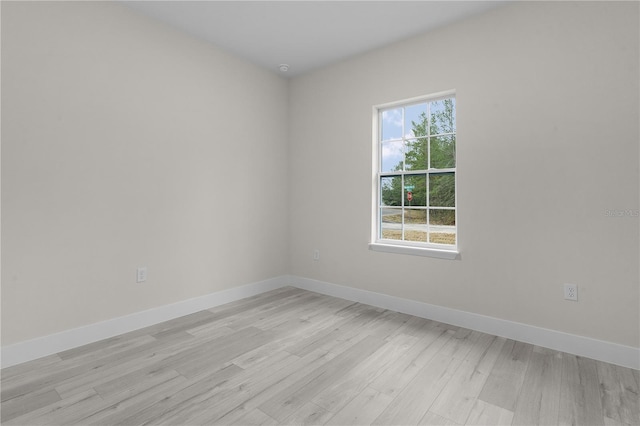 spare room featuring light hardwood / wood-style flooring