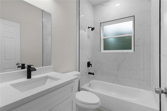 full bathroom with vanity, toilet, and tiled shower / bath