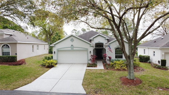 view of front of house with roof with shingles, stucco siding, an attached garage, driveway, and a front lawn