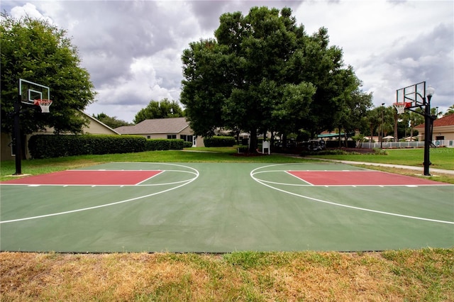 view of sport court with community basketball court and a lawn