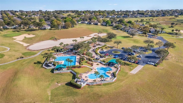 bird's eye view with view of golf course