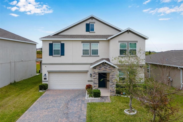 view of front of property featuring a garage and a front yard