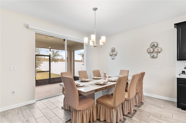 dining area featuring an inviting chandelier