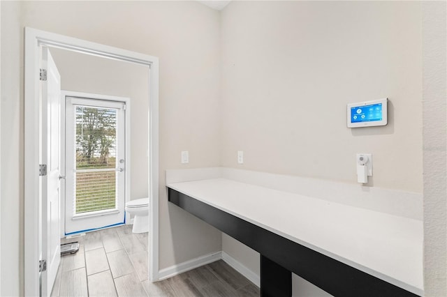 bathroom featuring toilet and hardwood / wood-style floors