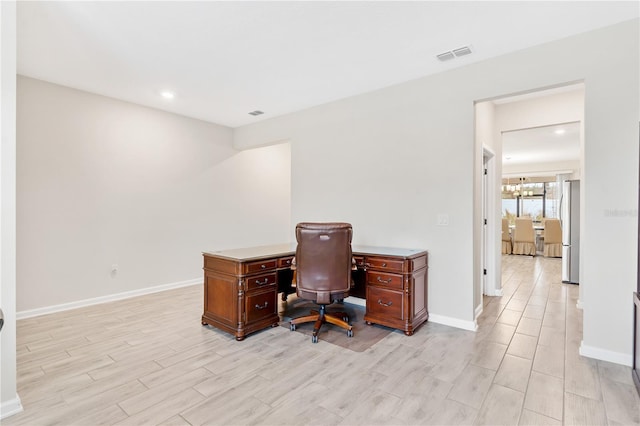 office area with a chandelier