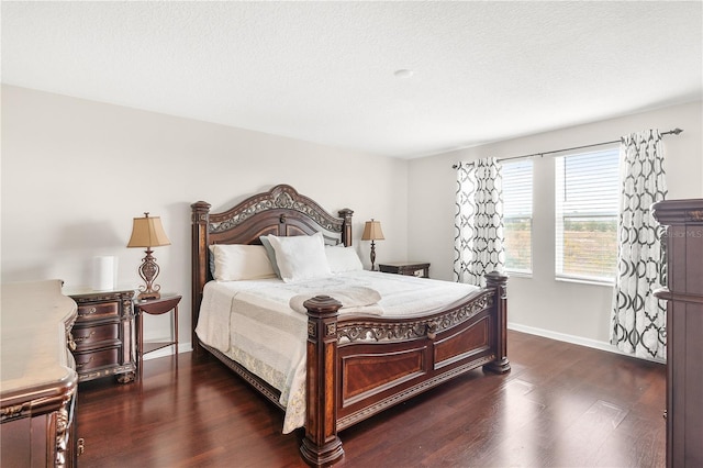 bedroom with dark hardwood / wood-style floors