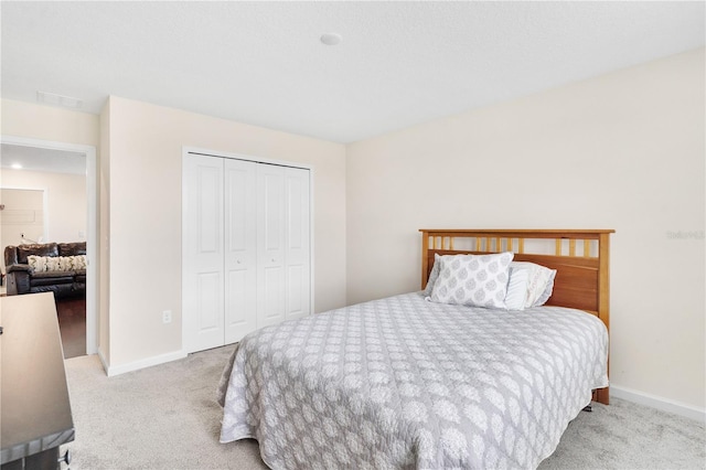 carpeted bedroom with a closet