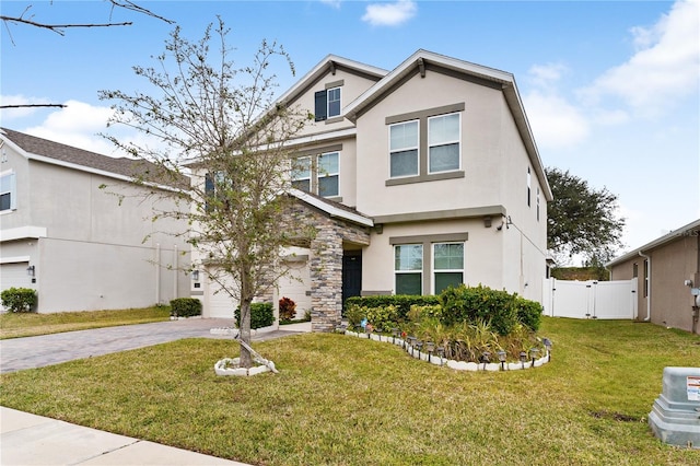 view of front of house with a garage and a front lawn