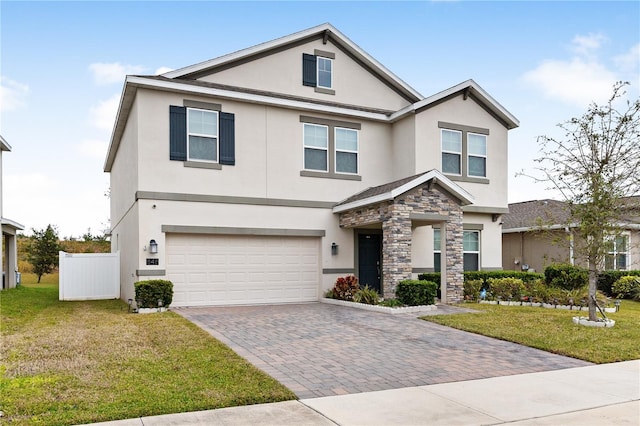 view of front facade with a garage and a front yard