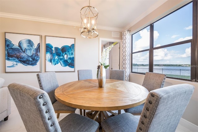 dining room featuring a water view, crown molding, and an inviting chandelier