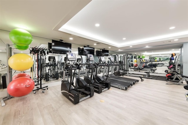 16300 County Road 455 Unit 414, Bella Collina, FL 34756 - gym featuring wood finished floors, a raised ceiling, and recessed lighting
