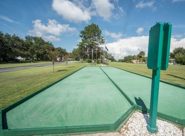 view of community featuring a yard