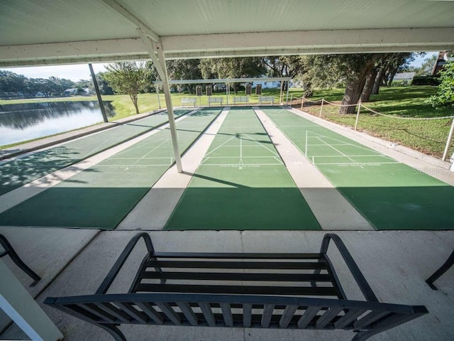 surrounding community featuring a water view