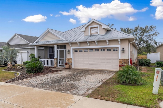 view of front facade featuring a garage and covered porch