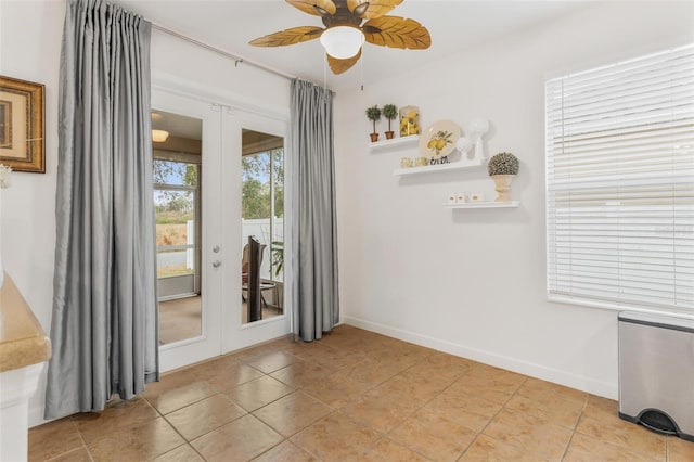 unfurnished room with french doors, ceiling fan, and light tile patterned flooring