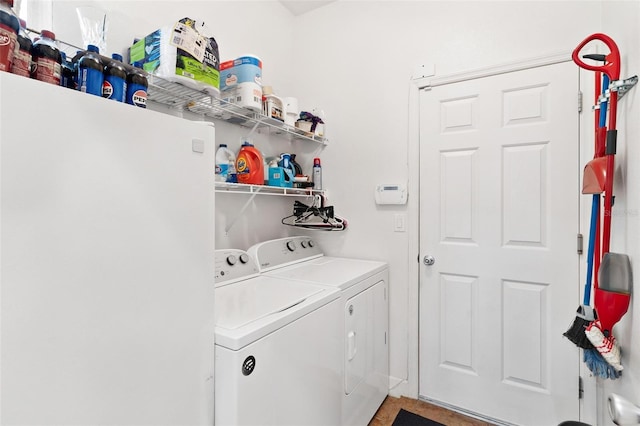 washroom with independent washer and dryer