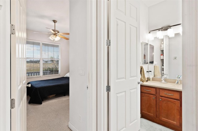 bathroom featuring vanity and ceiling fan