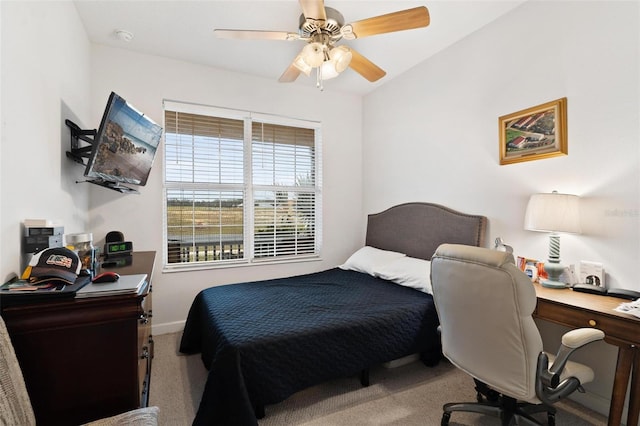 bedroom with ceiling fan and carpet flooring