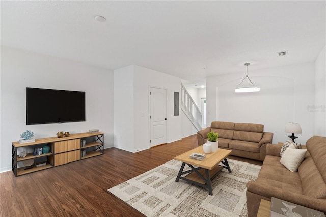 living room featuring hardwood / wood-style flooring and electric panel