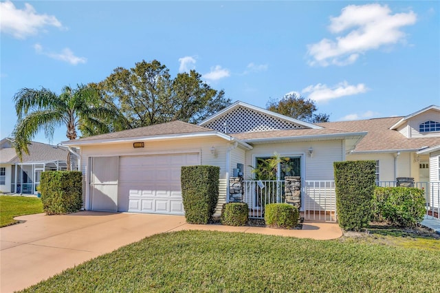 view of front of property with a garage and a front lawn