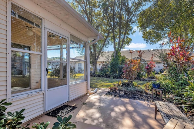 view of patio / terrace featuring a sunroom