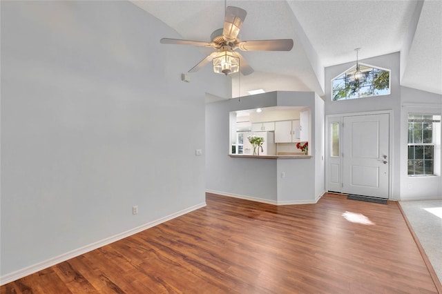 entryway featuring high vaulted ceiling, ceiling fan, and light hardwood / wood-style flooring