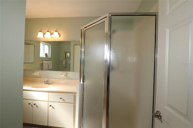 bathroom with vanity and walk in shower