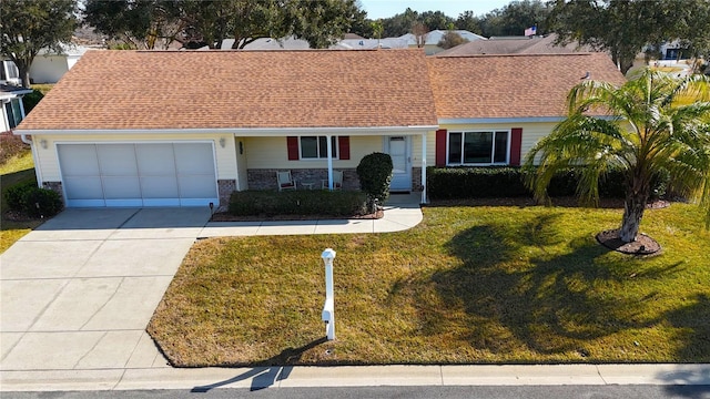 single story home with a garage and a front yard