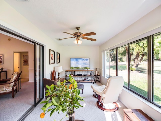 sunroom / solarium with ceiling fan