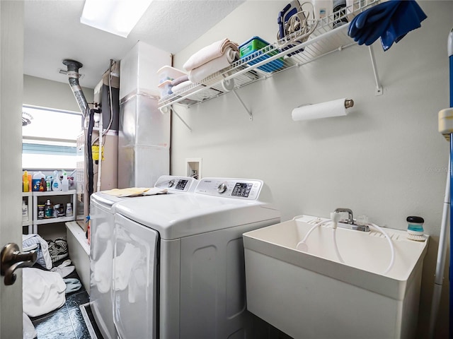 washroom featuring independent washer and dryer and sink