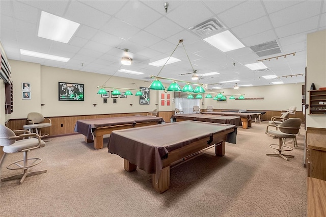 playroom with a drop ceiling, carpet floors, wooden walls, and billiards