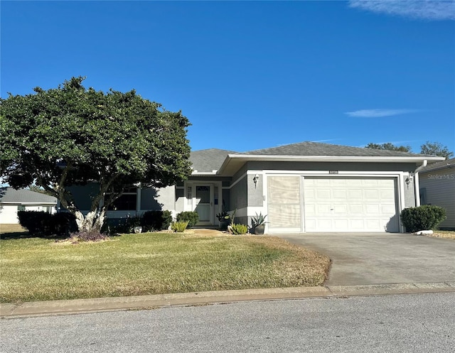 view of front facade with a garage and a front yard