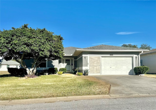 view of front of property featuring a garage and a front yard